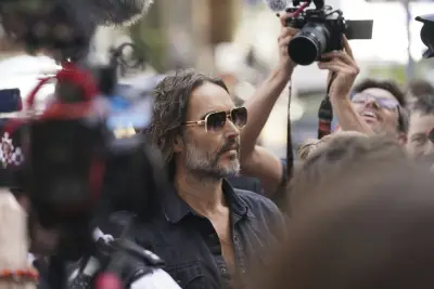 Russell Brand arrives at a London court to face rape and sexual assault charges