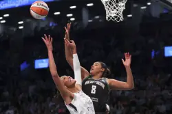 New York wins opener against Las Vegas 92-78 after celebrating 2024 title with ring, banner ceremony