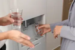 Dear Abby: My coworker has been filling the office drinking fountain with lead-filled water